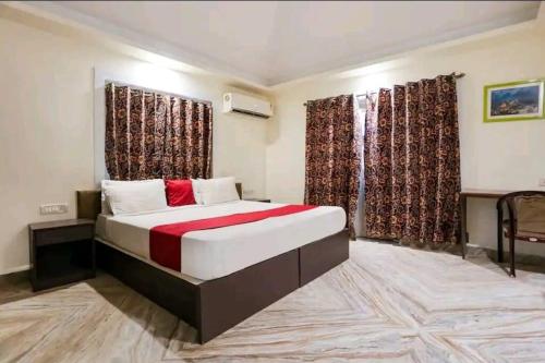 a bedroom with a large bed in a room at BnBBuddy Paradise Cove Retreat, 6BHK, Goa in Majorda
