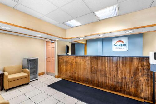 a waiting room at a dental office with a reception desk at Suburban Studios Chattanooga Northeast - Ooltewah in Chattanooga