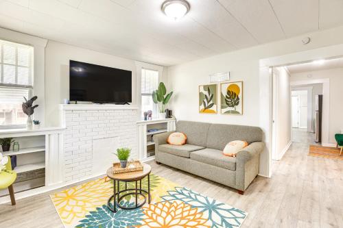 a living room with a couch and a tv at Pet-Friendly Birmingham Home 7 Mi to Downtown! in Birmingham