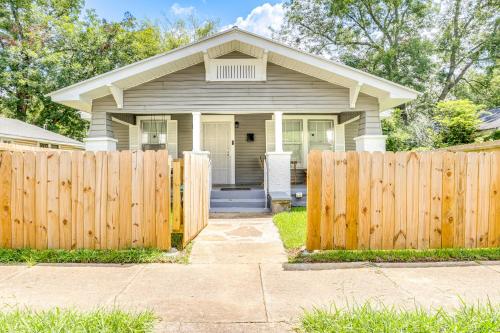 a wooden fence in front of a house at Pet-Friendly Birmingham Home 7 Mi to Downtown! in Birmingham