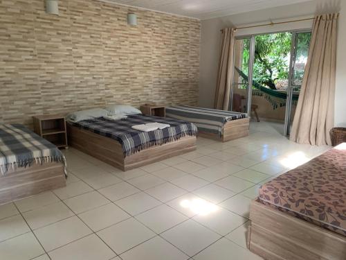 Postel nebo postele na pokoji v ubytování Hotel Pousada Casuarinas