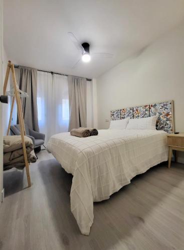a bedroom with a large bed in a room at Apartamentos Crispín Candela in Corella