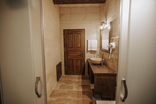 a bathroom with a sink and a mirror at Lagania In Cave in Urgup