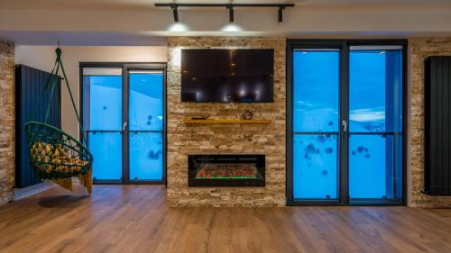 TV a/nebo společenská místnost v ubytování New Gudauri Geoflats