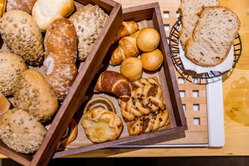 a bunch of different types of bread on a table at Boutique-Hotel Rüden in Schaffhausen