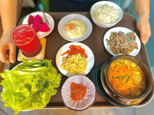 a tray filled with different types of food on a table at Paragon Hotel PMH in Ho Chi Minh City