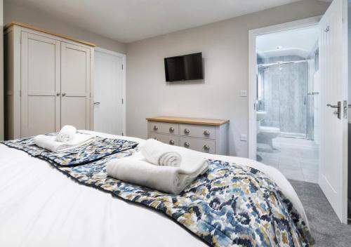 Кровать или кровати в номере Curlew Crag Cottage