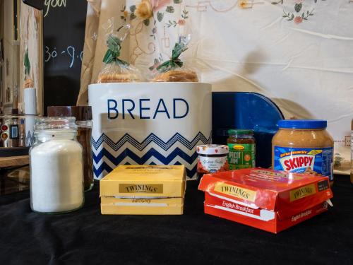 a table with bread and other food items on it at Azzurro Boutique Hotel - Surry Hills in Sydney