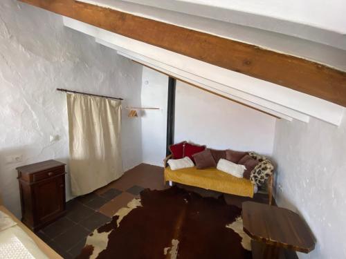 Ένα ή περισσότερα κρεβάτια σε δωμάτιο στο Casita de los Azulejos in Comares