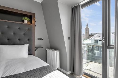 Postel nebo postele na pokoji v ubytování Hotel Aska