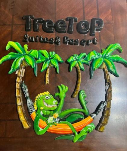 a sign for a hotel with a frog on a hammock at Palm Luxury King Suite, Pool, ocean views, beach short walk West Bay West End in West Bay