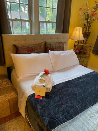 a bedroom with a bed with a stuffed animal on it at Cozy room near Airport & Highway in Saint Louis