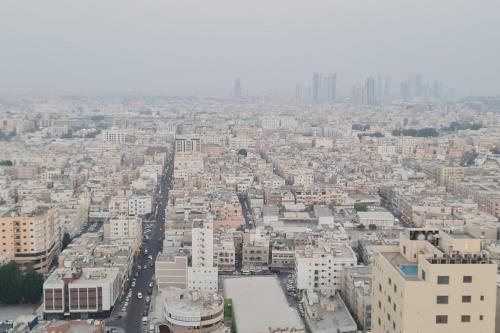 an aerial view of a city with tall buildings at High Floor 31 with Skyline View in Manama