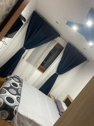 a view of a room with a bed and a window at Apartamentul lui Vlad in Jurilovca