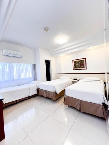 Katil atau katil-katil dalam bilik di Royal Center Hotel Lourdes