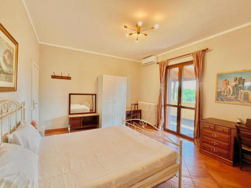 Postel nebo postele na pokoji v ubytování B&B Terre Toscane