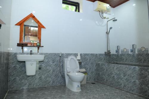 Ένα μπάνιο στο Restful River Bungalow