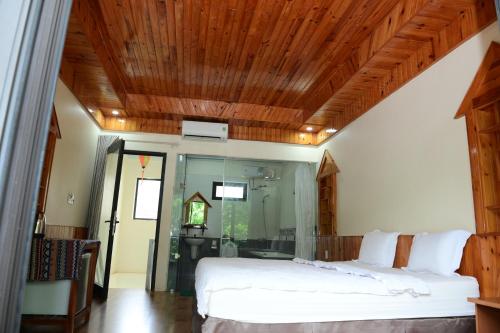 Ένα ή περισσότερα κρεβάτια σε δωμάτιο στο Restful River Bungalow