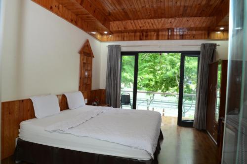 Ένα ή περισσότερα κρεβάτια σε δωμάτιο στο Restful River Bungalow