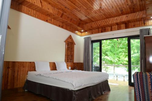 Ένα ή περισσότερα κρεβάτια σε δωμάτιο στο Restful River Bungalow