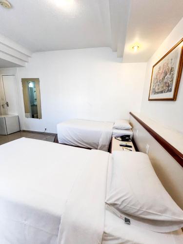 Katil atau katil-katil dalam bilik di Royal Center Hotel Lourdes
