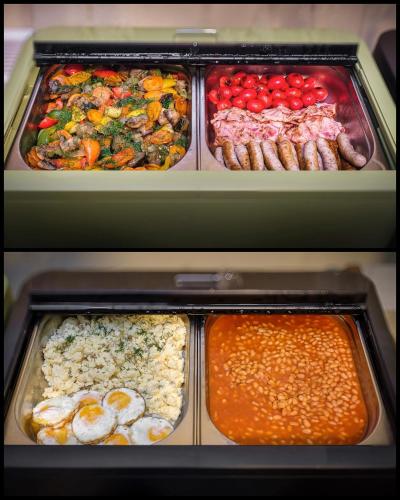 two trays of food with different types of food at Maestro by Adrez in Prague