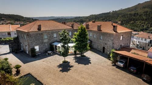 an aerial view of a building with trees in a courtyard at Quinta do Terreiro - Turismo de Habitacao in Lamego