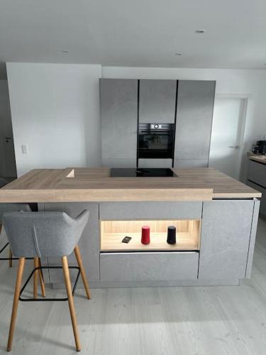 Kuchyň nebo kuchyňský kout v ubytování 3,5 Zimmer Wohnung im fünften Stock eines Neubau
