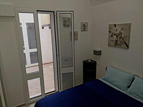 Postel nebo postele na pokoji v ubytování La casa azzurra