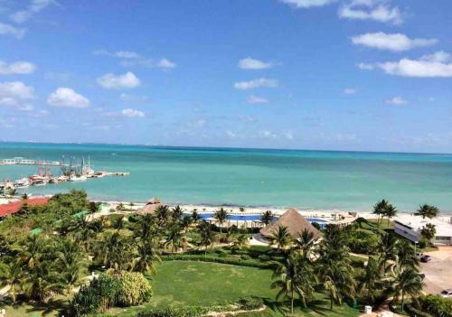 a view of the beach and the ocean at MARINA Beachfront 2 BDR by CASA PARAISO in Cancún