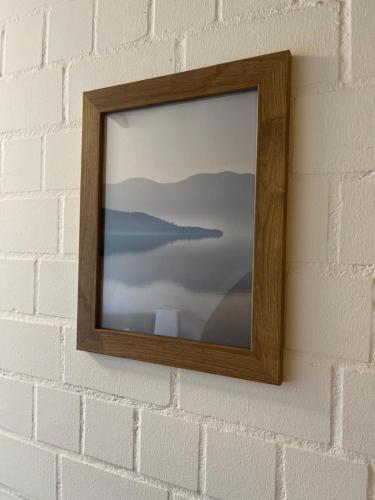 a picture frame hanging on a brick wall at Alt Mölln, Apartment 11 in Alt Mölln