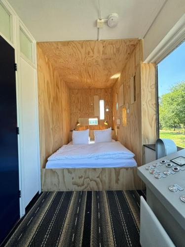 a bedroom with a large bed in a room at SWEETS - Gerben Wagenaarbrug in Amsterdam