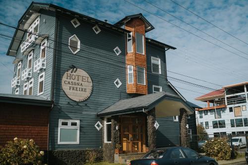 a black building with a hotel called canyon theatre at Hotel Terrazas del Lago in Puerto Varas