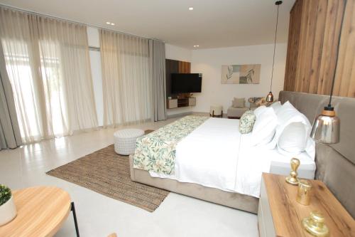 Ένα ή περισσότερα κρεβάτια σε δωμάτιο στο Hotel Boutique Palma Arena
