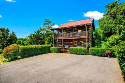 a house with a large driveway in front of it at Misty Mountain Game Room and Hot Tub in Pigeon Forge