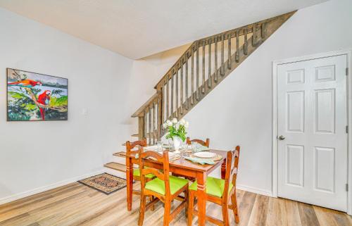 a dining room with a wooden table and chairs at 8 Mi to Ocala Quiet Silver Springs Home with Grill! in Silver Springs