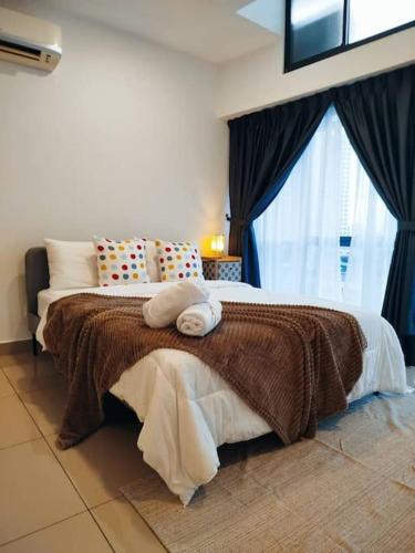 a bedroom with a large bed and a window at Cozy Haven Superior Studio Free Private Parking Netflix in Petaling Jaya