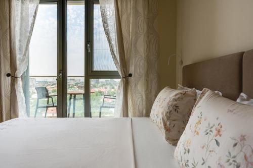 Ένα ή περισσότερα κρεβάτια σε δωμάτιο στο Cozy Nest in Premium Residence