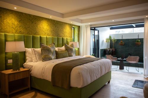 Katil atau katil-katil dalam bilik di Le Petit Manoir Boutique Hotel