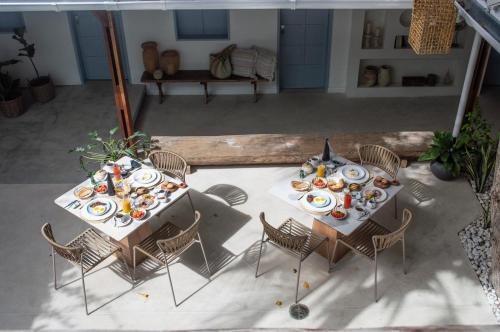 an overhead view of two tables and chairs with food on them at Laguna By LD in El Roque