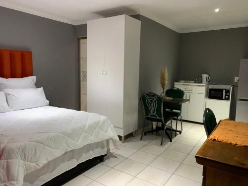 Voodi või voodid majutusasutuse Normans in St Georges strand beach toas