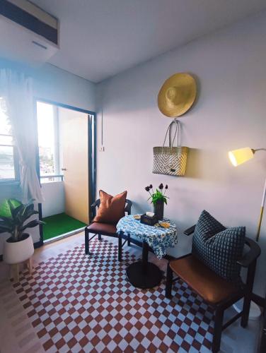 a living room with a couch and a table at stay in style at nimman in Chiang Mai