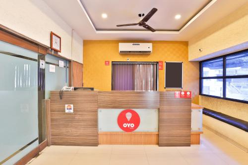 an office with a reception desk in a room at Hotel O Sunrise in Vadodara