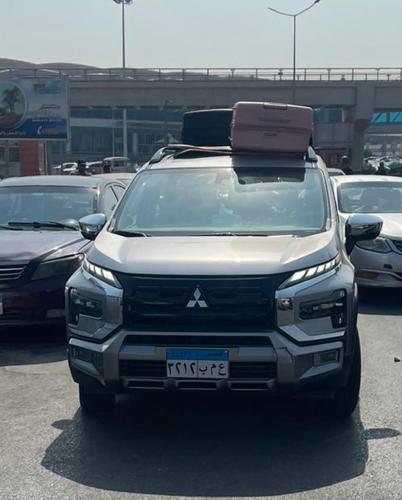 a white truck parked in a parking lot at modern villa with coverable pool sheik zayed in Sheikh Zayed