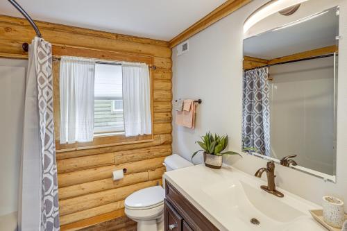 a bathroom with a toilet and a sink and a mirror at Mountain-View Red Lodge Home - 10 Mi to Skiing! in Red Lodge