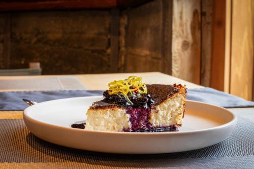 a piece of cake on a plate on a table at The Lodge at Bow Lake in Lake Louise