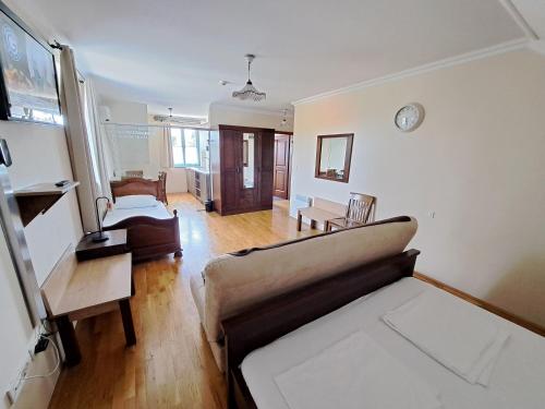 a living room with a couch and a table at Villa Parma in Maribor Self check - in in Maribor