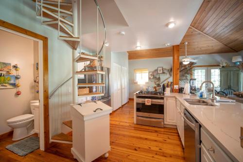 a kitchen with a sink and a stove at Blackbeard`s Hideaway in Key West