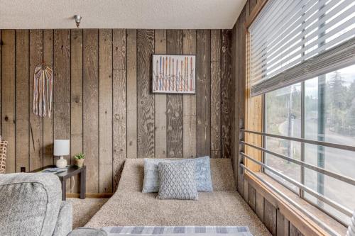 a living room with a couch and a window at Thunderhead Lodge Condo 204 - Modern Heated Pool & Games in Government Camp