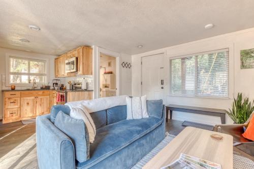 a living room with a blue couch and a table at Riverbend Cabin 1 - Lolo Bungalow in Rhododendron